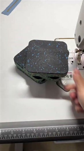 Sewing machine sound insulation and shock absorption mat.