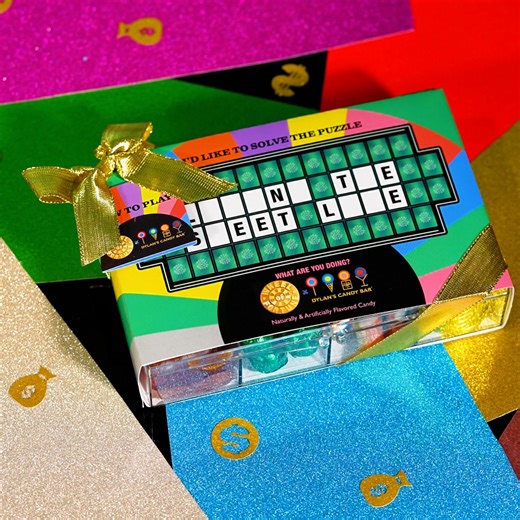 Solve the puzzle! This interactive Tackle Box is filled with Wheel of Fortune-themed treats and perfect for watch parties 🍬 | Dylan's Candy Bar