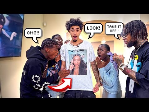 Wearing A T-Shirt With A Picture Of Miah On It In Front Of Amar…