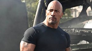 What was The Rock's first movie before leaving WWE?
