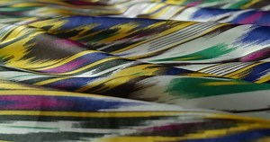 Native and traditional uzbek textile - khan atlas, close-up video