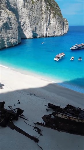 📍Navagio Beach, Greece — a hidden paradise framed by towering white cliffs and turquoise waters, home to the famous shipwreck MV Panagiotis. Accessible only by boat, visitors can also admire its beauty from the cliff-top viewpoint for stunning aerial shots. Best visited early morning or late afternoon to avoid crowds and capture golden light. Unique experiences include sailing into the cove, photographing the dramatic cliffs, and feeling the surreal isolation of the beach. No shops or facilitie