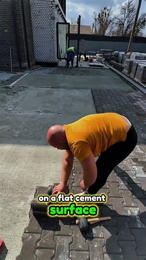 Construction workers install T-shaped paving blocks.#shorts #construction #satisfying #fyp
