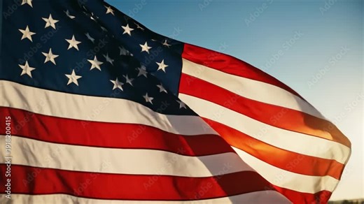 American flag waving in wind slow motion 4k cinematic footage blue sky