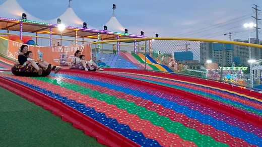 Colorful Rainbow Slide Fun at Kid's Amusement Park