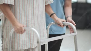 senior patient learning to use walker with physical therapist