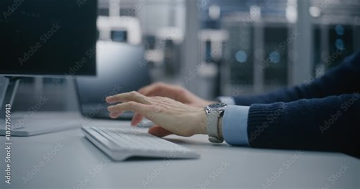 Close Up Remote Control, Focused Engineer Supervising Systems Via Digital Dashboard. Man Supervises Complex Systems Using Keyboard in High Tech Facility. Remote Monitoring and Engineering Oversight.