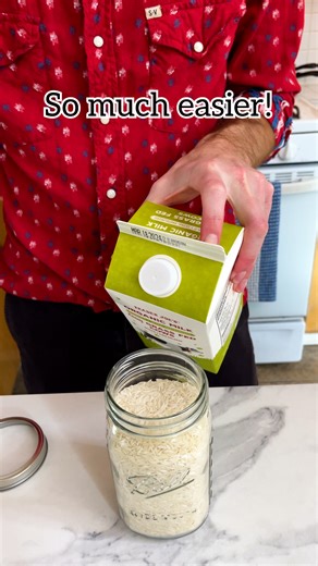 Easy storage idea! 🤯 Use milk carton tops to make mason jar spouts! #masonjar #organization #rice #StorageSolutions #kitchenhacks | Jeff & Lauren