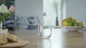 Adding ice to a glass with chopsticks - Free Stock Video