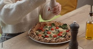 Top down view of the Neapolitan pizza cutting by the scissors
