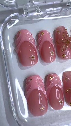Pink French Nails with Golden Bloom Designs