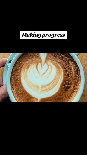 Making progress: coffee latte art by barista