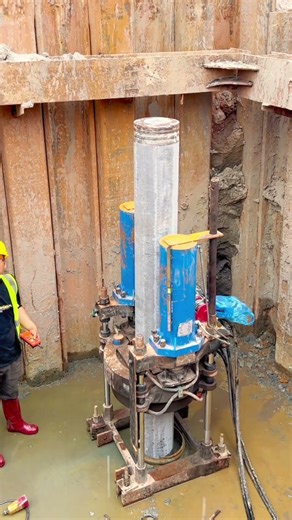 Hydraulic Piling Machine Operating in a Construction Trench