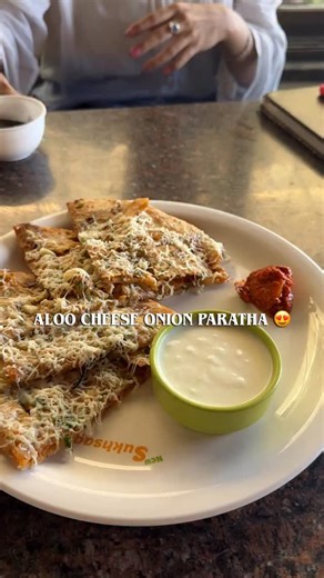 Eat Local | Food & Travel Vlogger on Instagram: "Cheese pull meets desi soul — onion cheese aloo paratha perfection! 🧀🔥"
