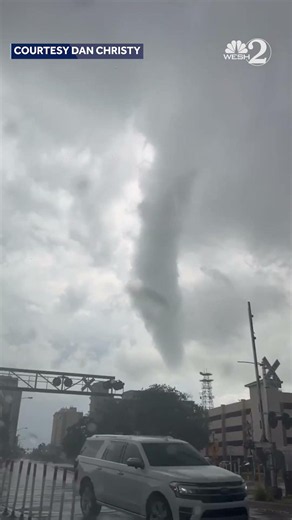 Funnel cloud forms near downtown Melbourne