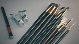 Blue brushes, tubes of paint and a pencil - Free Stock Video