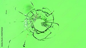 Super Slow Motion of Shattered Glass Isolated on Green Background. Break Glass from the Gunshot. Filmed on High Speed Cinema Camera, 1000 fps. Stock Video