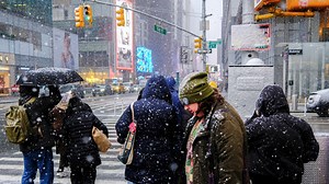 Arctic blast drops temperatures, as storms move in along the East Coast
