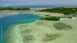Aerial Forward Beautiful View Of Green Island In Sea On Sunny Day - Suva, Fiji