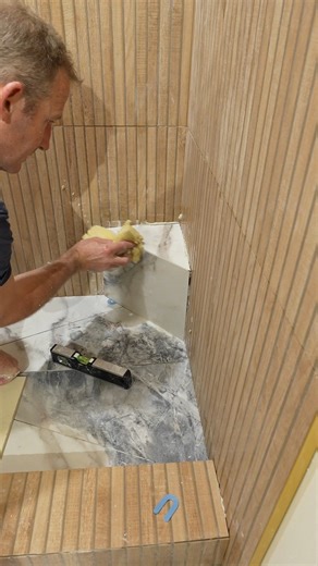 Tile Corner Shower Step 🙌 #diy #tile #bathroomremodel #bathroomremodelingteacher | Bathroom Remodeling Teacher