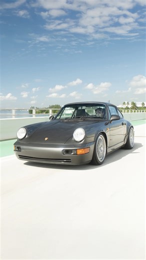 PCARMARKET on Instagram: "Your Daily Dose of Flat Six Noises… AUCTION LIVE: RoW 1990 Porsche 964 Carrera 2 Coupe 5-Speed Finished in Slate Grey Metallic over a Black interior, this RoW 1990 Porsche 964 Carrera 2 Coupe was imported to the U.S. from Japan in April 2025 and received a top-end engine rebuild by the air-cooled specialists KMW Motorsports, along with a new Sachs clutch kit for the 5-speed G50 manual transaxle. It has also been enhanced with a 991 GT3 center-mounted exhaust, Fabspeed R