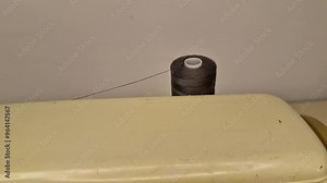 Spool of sewing thread on a home sewing machine. Stock Video