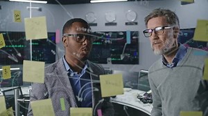 clip-1104633781-stock-trader-investment-advisor-draw-on-glass