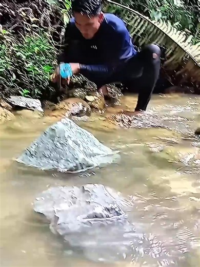 Testing River Rocks with a Chisel for Hidden Gems