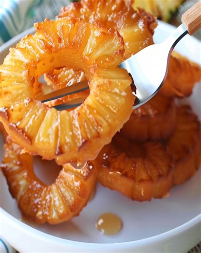 70K views · 515 reactions |  Golden, crispy, and oh-so-delicious… these Pineapple Fritter Rings are coated in spiced batter, fried to perfection, and dusted with cinnamon sugar. The perfect snack, dessert, or party treat!  They disappear fast, so make a double batch! Would you enjoy these as a snack or dessert❓  #PineappleRecipes #EasyDesserts #SweetTreats | Optimal Recipes | Facebook