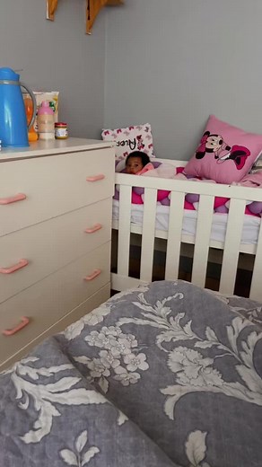 Adorable Toddler in Charming Crib Setting
