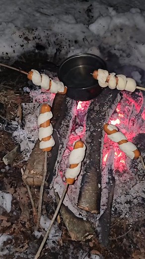 Cooking some bannock jalapeño cheddar dogs over a campfire with @1601outdoors 🏕 #fyp #foryourpage #campfirecooking #outdoorcooking #outdoors #camping #wintercamping | Survival Life