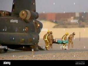 In this image made from video, Wednesday Nov. 4, 2009, a casualty is unloaded into an ambulance before being taken to a base hospital in Helmand Province, Afghanistan, after five British soldiers were shot dead in an attack. The five soldiers, three from the Grenadier Guards and two from the Royal Military Police, were killed in the Nad-e'Ali district of Helmand Province on Nov. 3, where they were training and operating with Afghan security forces, when an Afghan policeman opened fire on them in