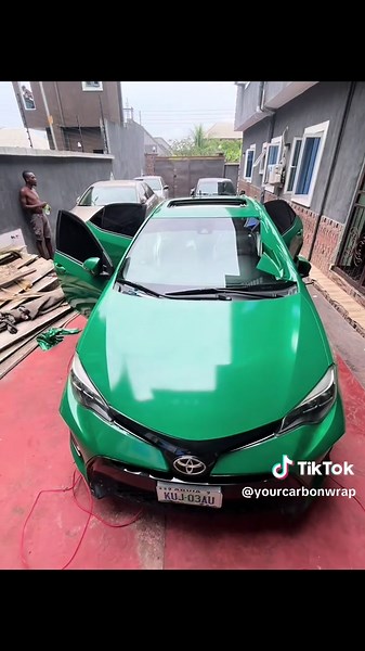 Glossy Green Vinyl Wrap on 2015 Toyota Corolla