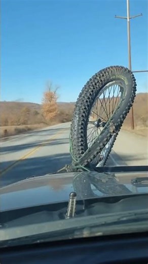 Car Drives On with Bicycle Stuck After Hitting Cyclist