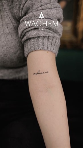 Minimalist Resilience Script Tattoo on Inner Arm