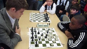 773K views · 7.1K reactions | When Magnus Carlsen went to school it was an unblievable moment for the childreen. One of them played a very good game, with an agressive opening, moving d4, c4, f3, e4, and then d5 (!) in the early moves against the best chess player of the wrold. The ending was happy for everybody. | Chess Champ | Facebook
