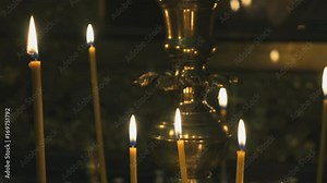 Religious traditions. Candlestick with burning candles in the temple. Close up