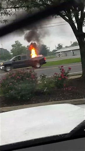 bystanders witness man setting fire to American flags..