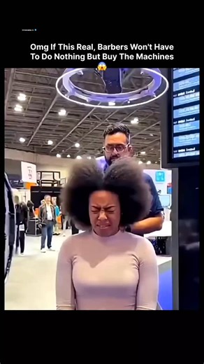 𝗂𝗇𝗇𝗈𝗏𝖺𝗍𝖾.𝗂𝗈 on Instagram: "This video, originally posted on X on December 18, 2025, depicts a demonstration of an automated haircut machine at Dubai Expo 2025. It features a woman with long, curly hair seated in a chair as a dome-shaped robotic device, equipped with sensors and LED lights, encases her head and trims her hair to a shorter, styled length in under 30 seconds. Subsequent segments show a male participant receiving a similar automated cut, with onlookers observing in an exhi