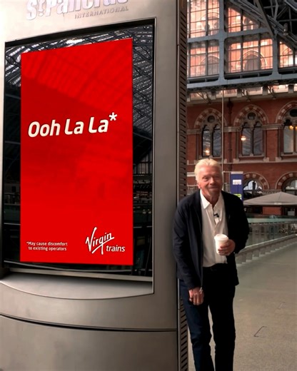 Virgin is bringing the magic to St Pancras today! Today, Virgin got the green light to launch a new train service through the Channel Tunnel, and break up a 30-year monopoly (not naming any names!). In true Virgin style, the moment we heard the news, we rolled out some cheeky banners and digital billboards at St Pancras. Our team rushed to the station to hand out some Virgin treats and make people smile. They say you should start as you mean to go on. And this is certainly our intention! We want