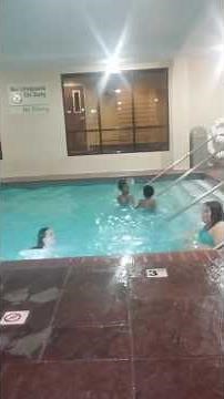 Two girls fighting in the pool