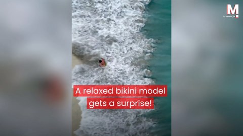 Drone captures bikini model's epic beach fail