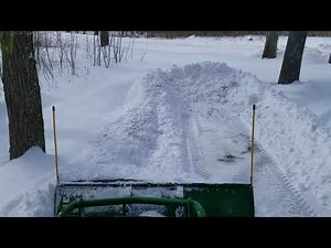 John Deere 1025R Plowing Deep Snow with Frontier Af-10 Snowplow