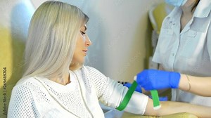 Preparation for blood test. Nurse or doctor in modern clinic prepares patient for blood test