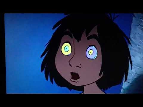 Kaa hypnotizes Mowgli