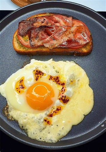 Egg toast with runny yolk and pesto for morning coffee