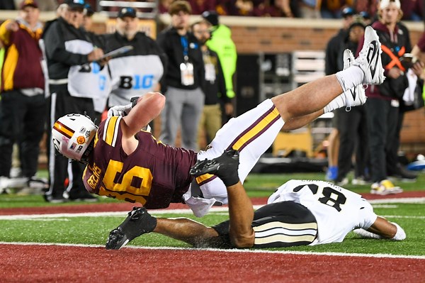 Koi Perich’s interception return lifts Minnesota over Purdue 27-20