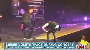 Justin Bieber vomits, keeps singing