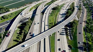 Aerial view of highway transportation with small traffic, highway interchange and junction, San Diego Freeway and Santa Ana Freeway. USU California
