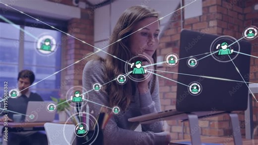 Woman typing at laptop in office, overlay appearing while typing and expanding into tech network